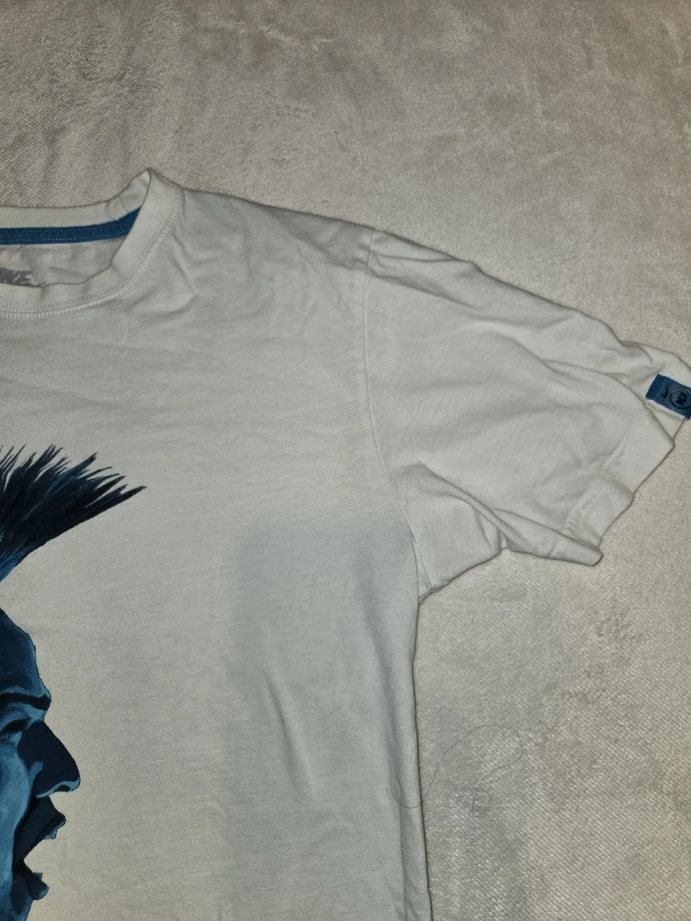 Nike White Short‑Sleeve Crewneck T‑Shirt with Blue Profile Graphic Warrior Tribe
